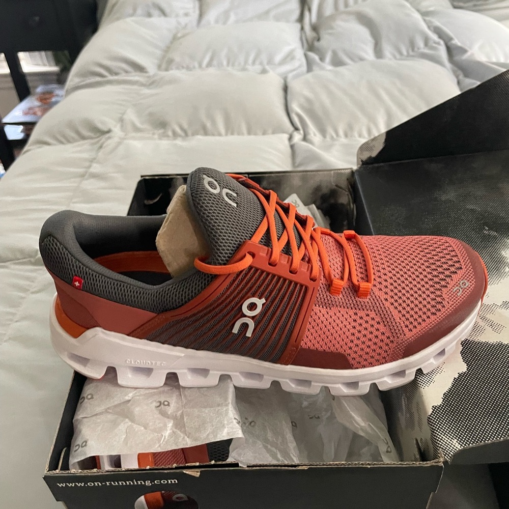 On Running Orange and White Cloudswift running shoes